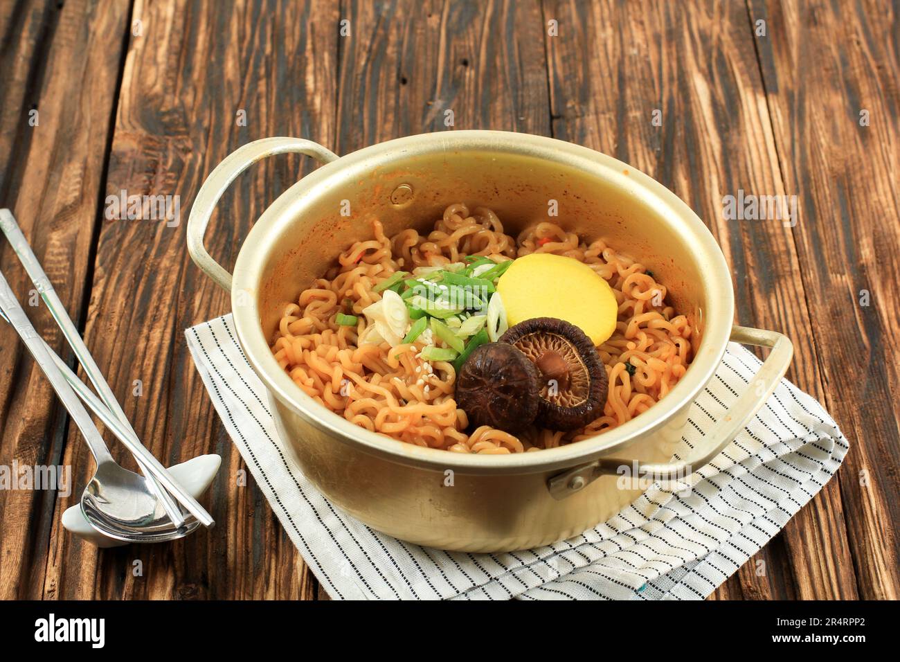 Close Up Korean Style Instant Noodle, Ramyeon or Ramyun with Spicy Flavour topped with Mushroom