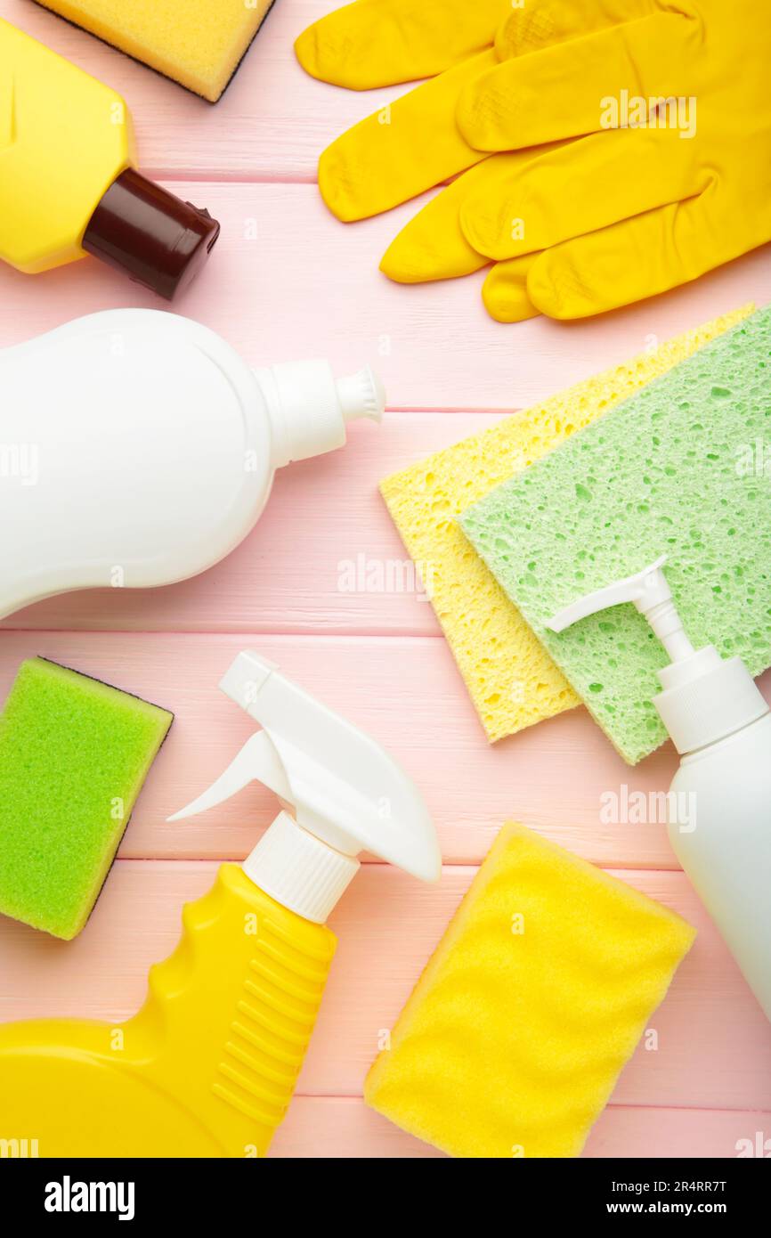 Cleaning Set. Tools for cleaning. Cleaning agents, spray, rubber gloves on blue background. Flat