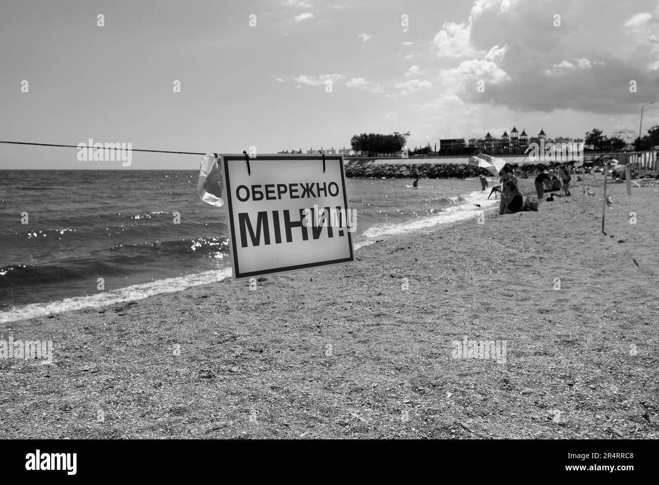ODESSA, UKRAINE - MAY 15, 2023: mine hazard sign on city sea sandy beach in Odessa during the Russian attack on Ukraine. Swimming is prohibited! Appro Stock Photo
