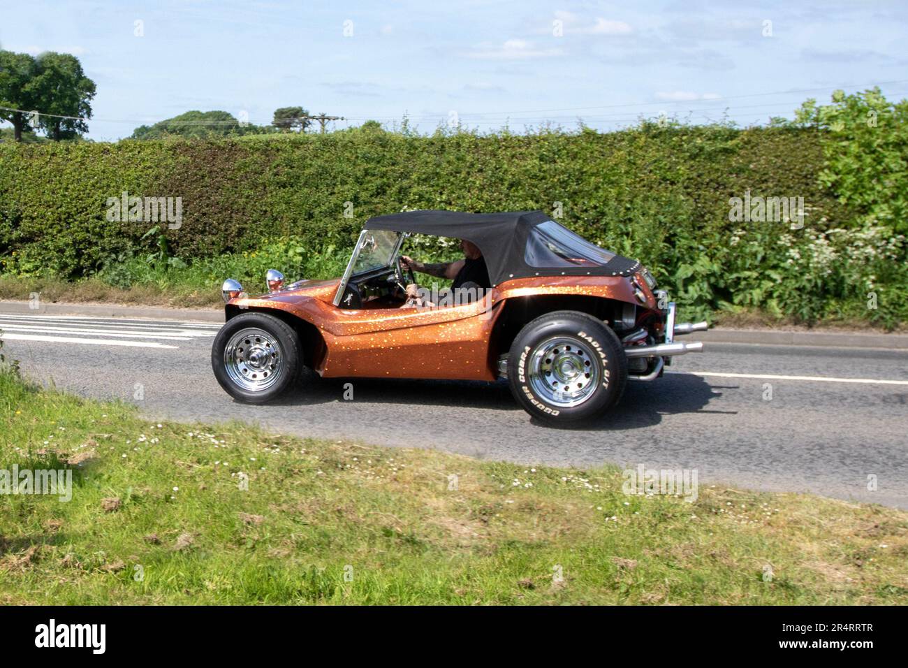 Modified Custom Orange-speckled vinyl-wrapped Volkswagen 1300 Beetle beach buggy; at the Capesthorne Hall Cheshire Classic  Show, 2023 Stock Photo