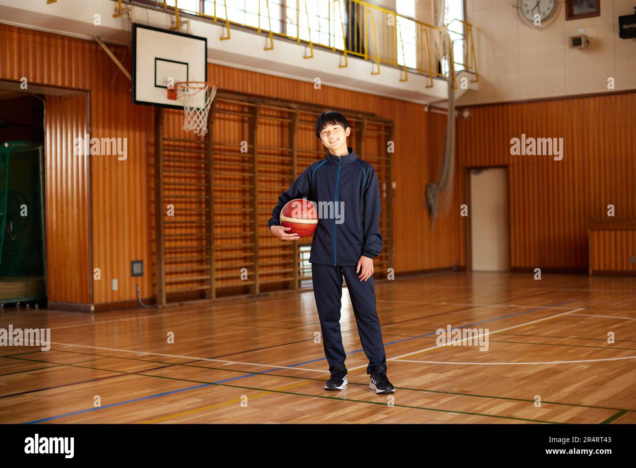 Japanese school kid playing basketball Stock Photo Alamy