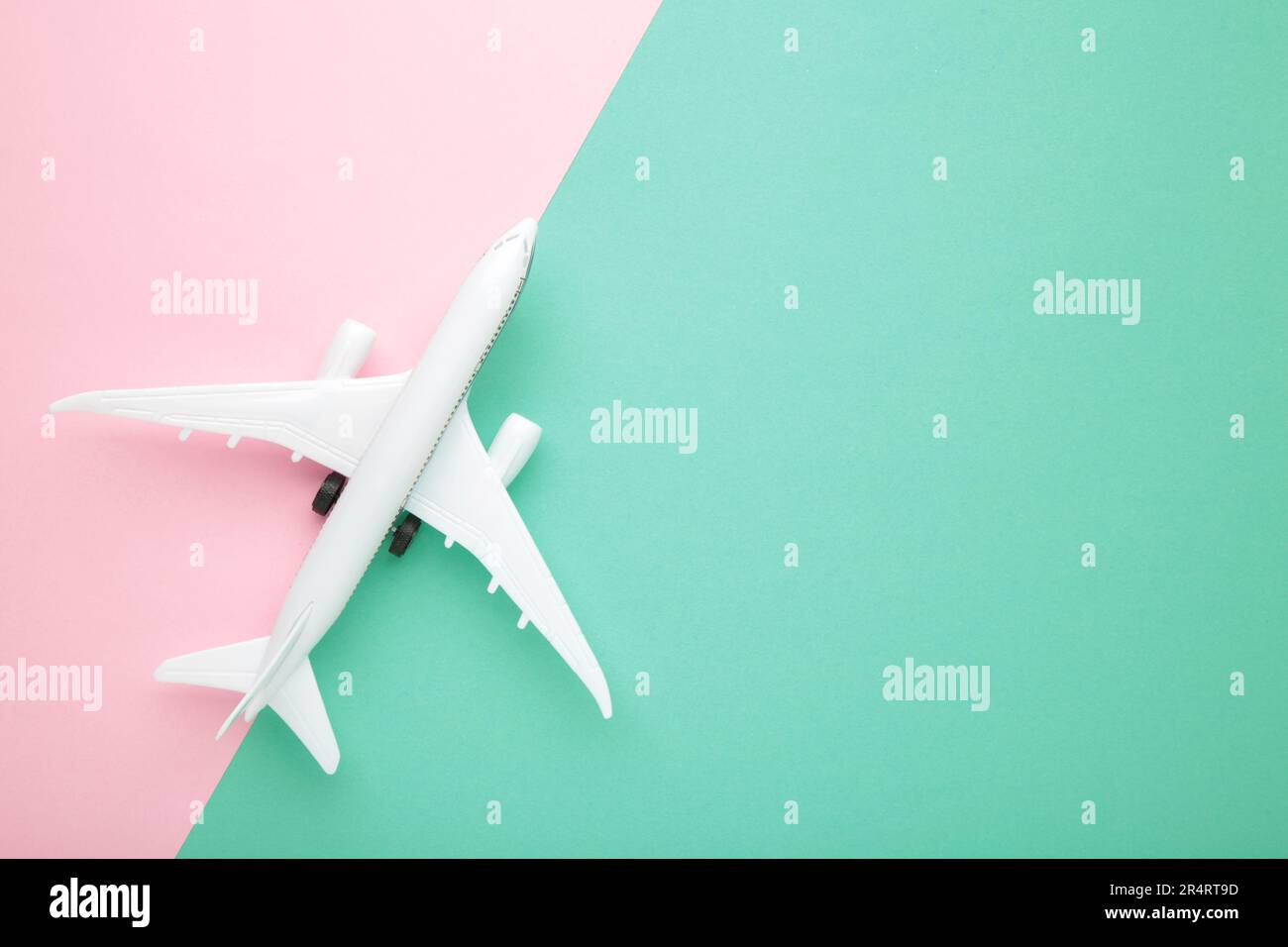 Model airplane on colour pastel color background. Travel concept Stock ...