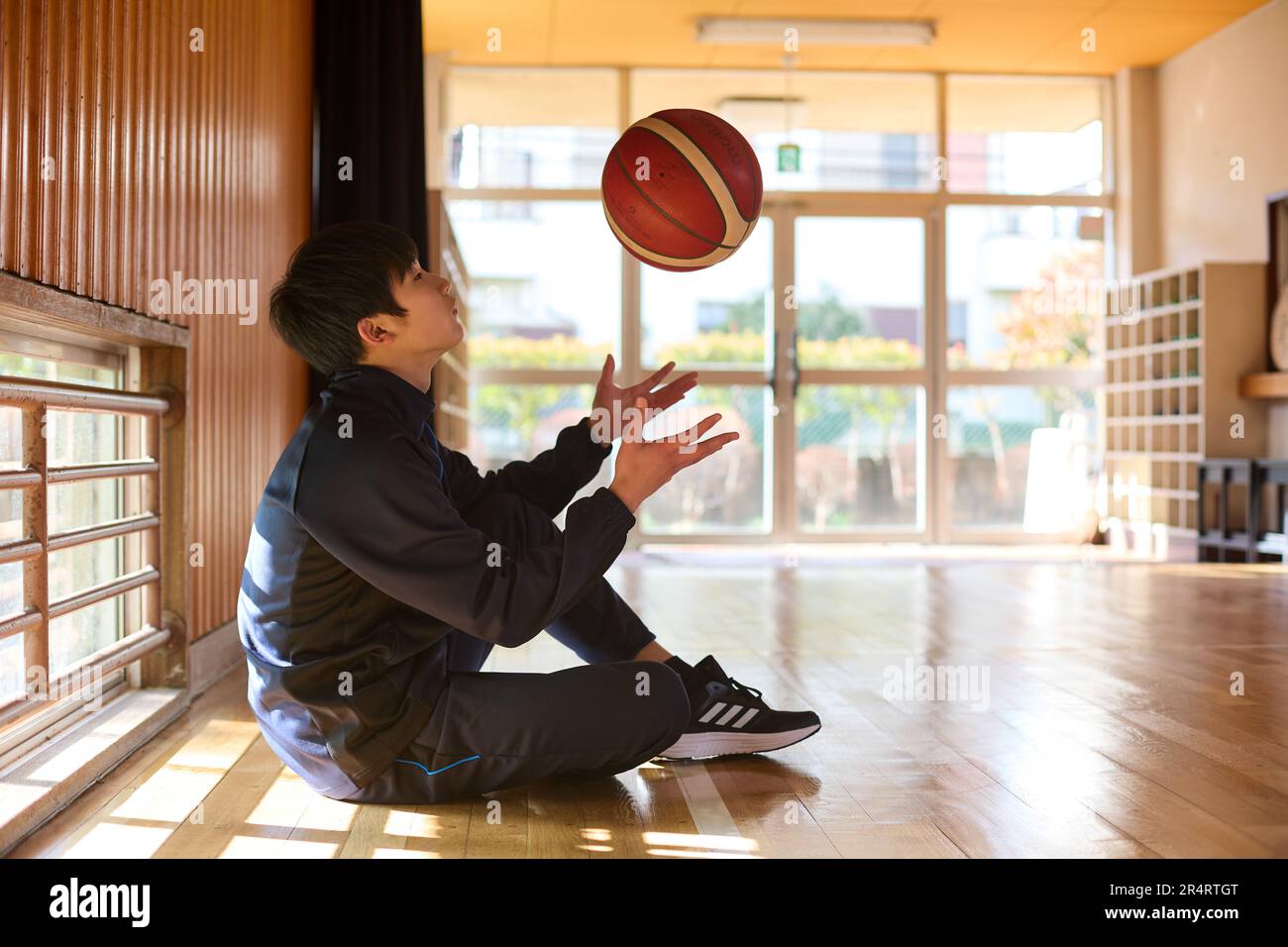 Japanese school kid playing basketball Stock Photo Alamy