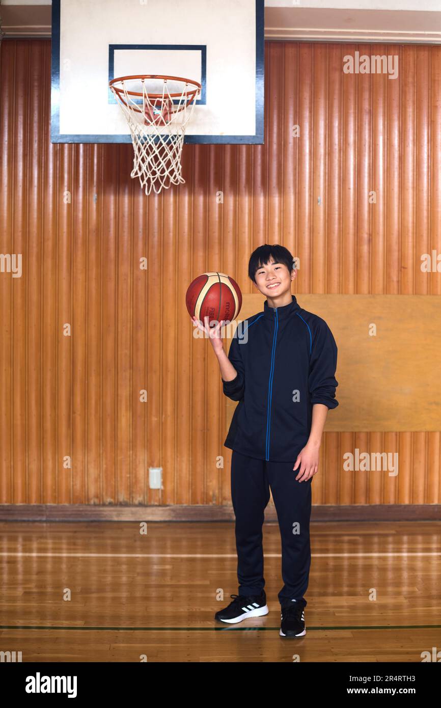 Japanese school kid playing basketball Stock Photo Alamy
