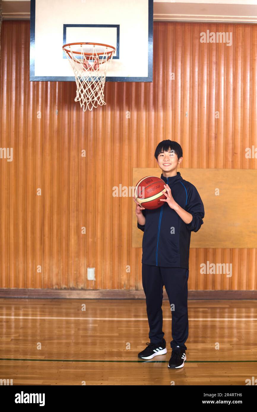 Japanese school kid playing basketball Stock Photo Alamy
