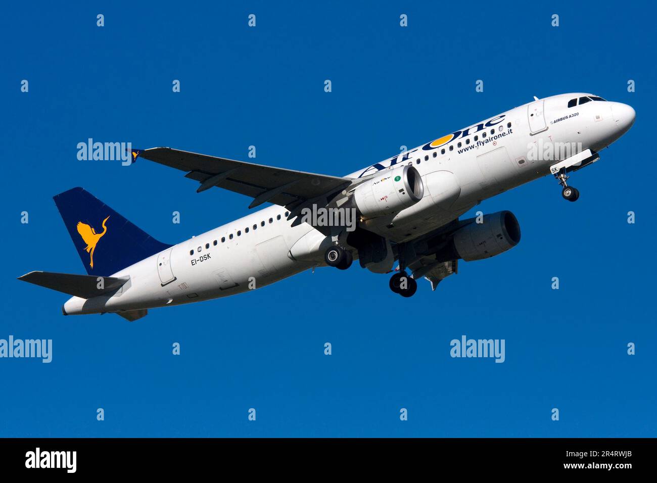 Air One Airbus A320-216 on climb out after taking off runway 13. Stock Photo