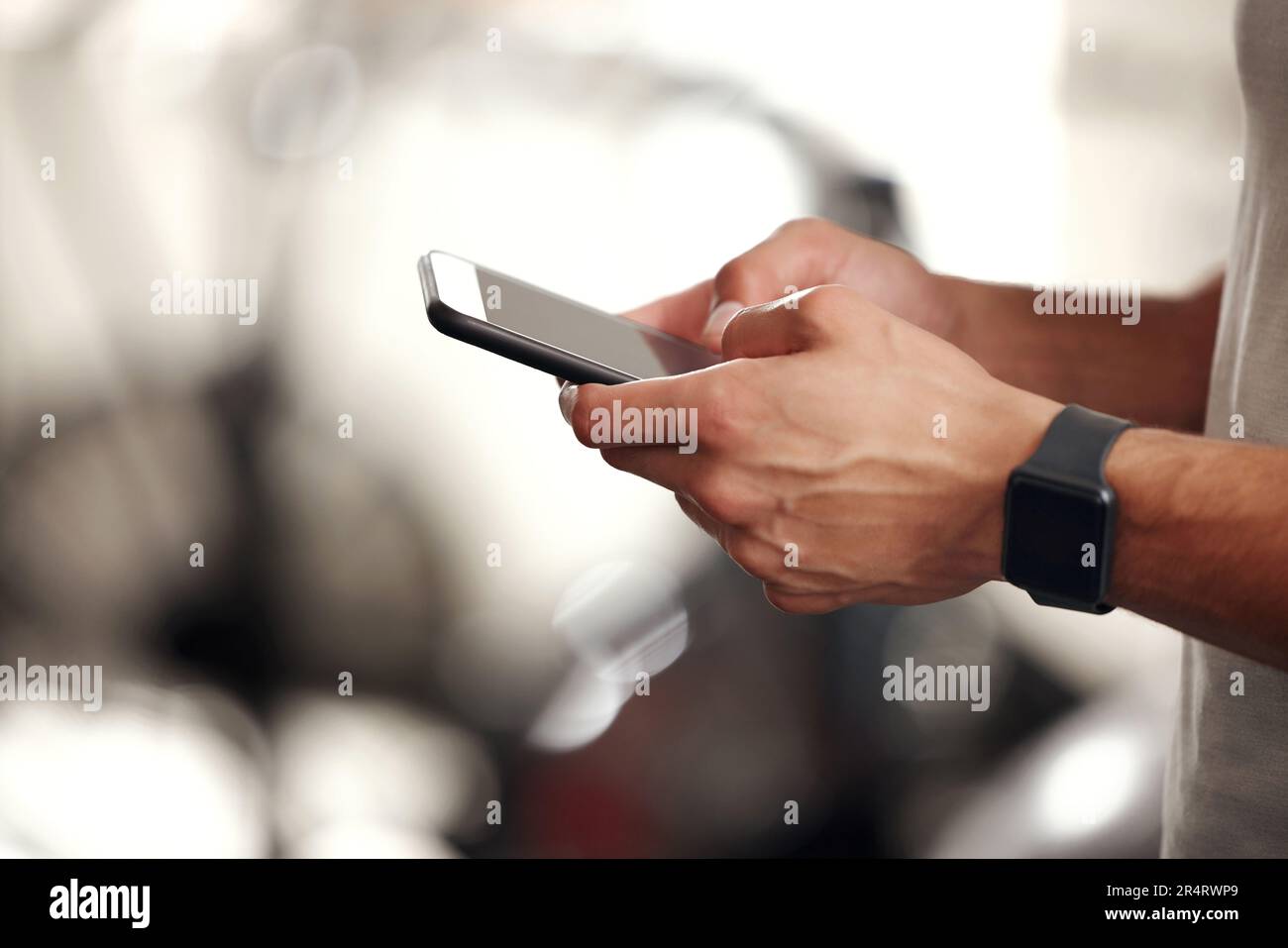 Fitness, typing and man with phone, smart watch and workout schedule at