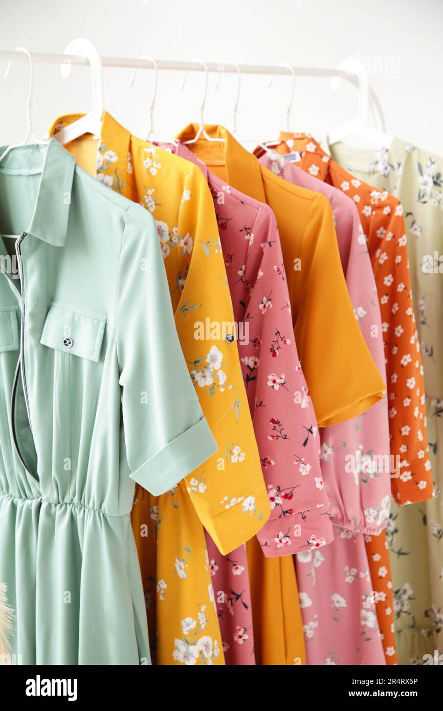 https://c8.alamy.com/comp/2R4RX6P/a-series-of-fashion-womens-dresses-on-hangers-in-a-white-cupboard-for-summer-and-spring-top-view-2R4RX6P.jpg