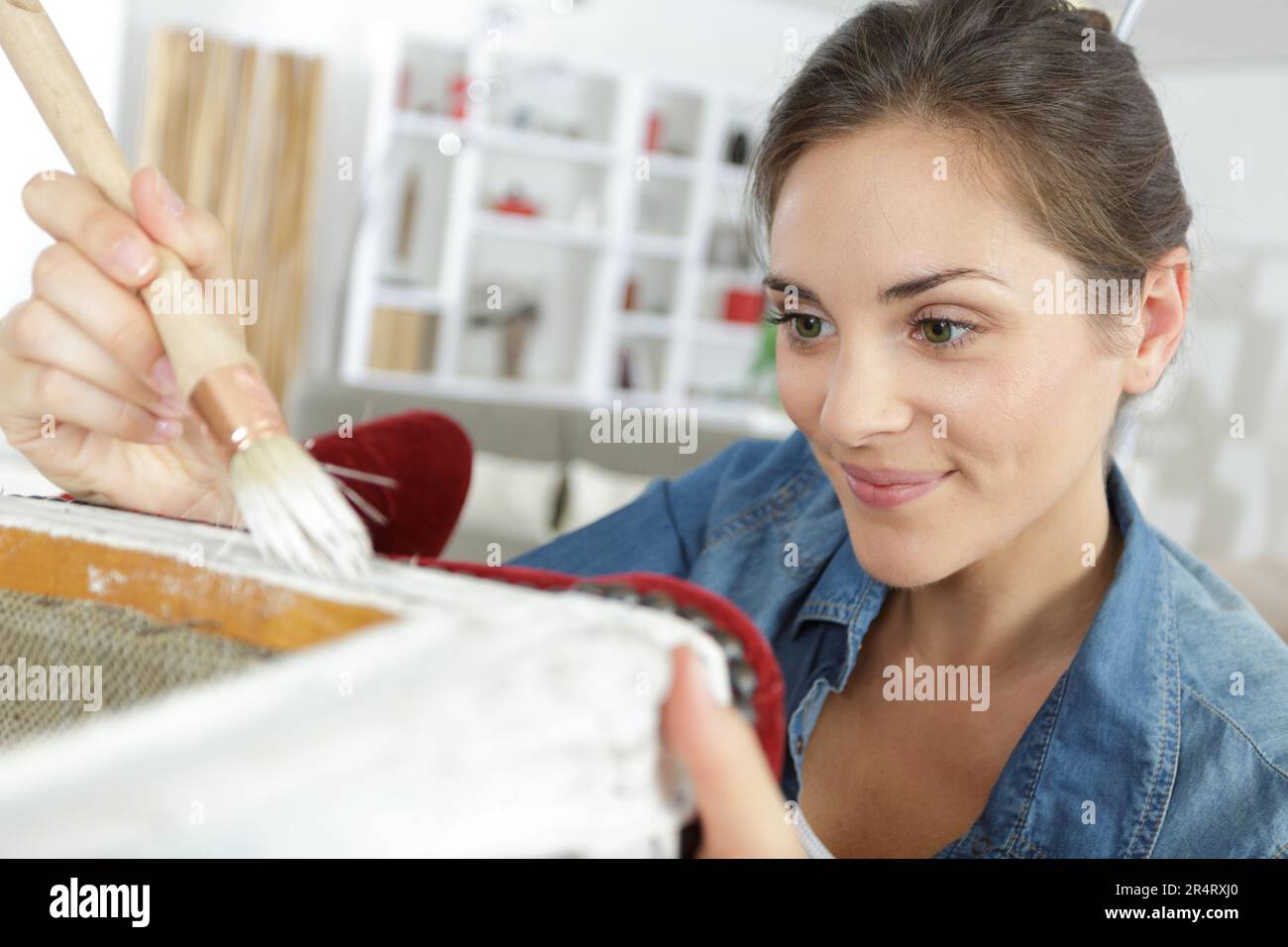 Woman restoring old chair hi-res stock photography and images - Alamy