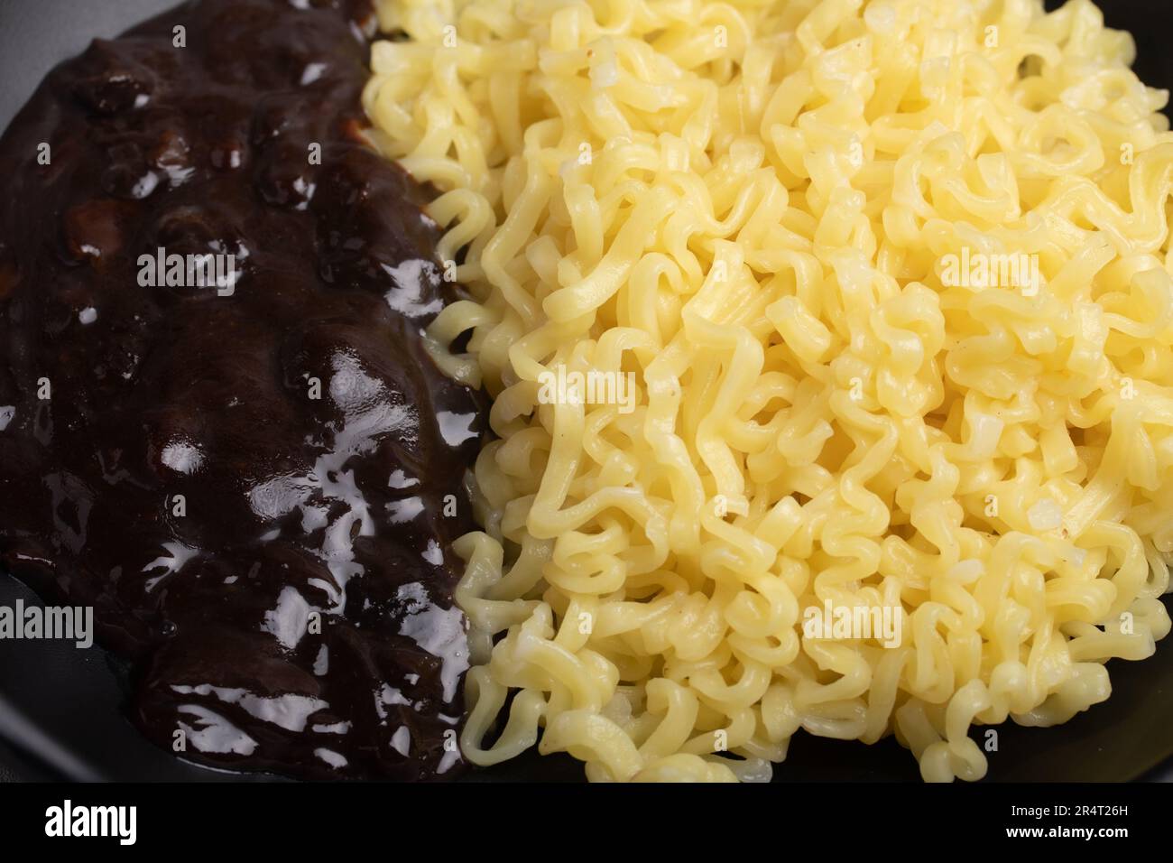 Jajangmyeon or JJajangmyeon Korean instant noodles in a black cup with