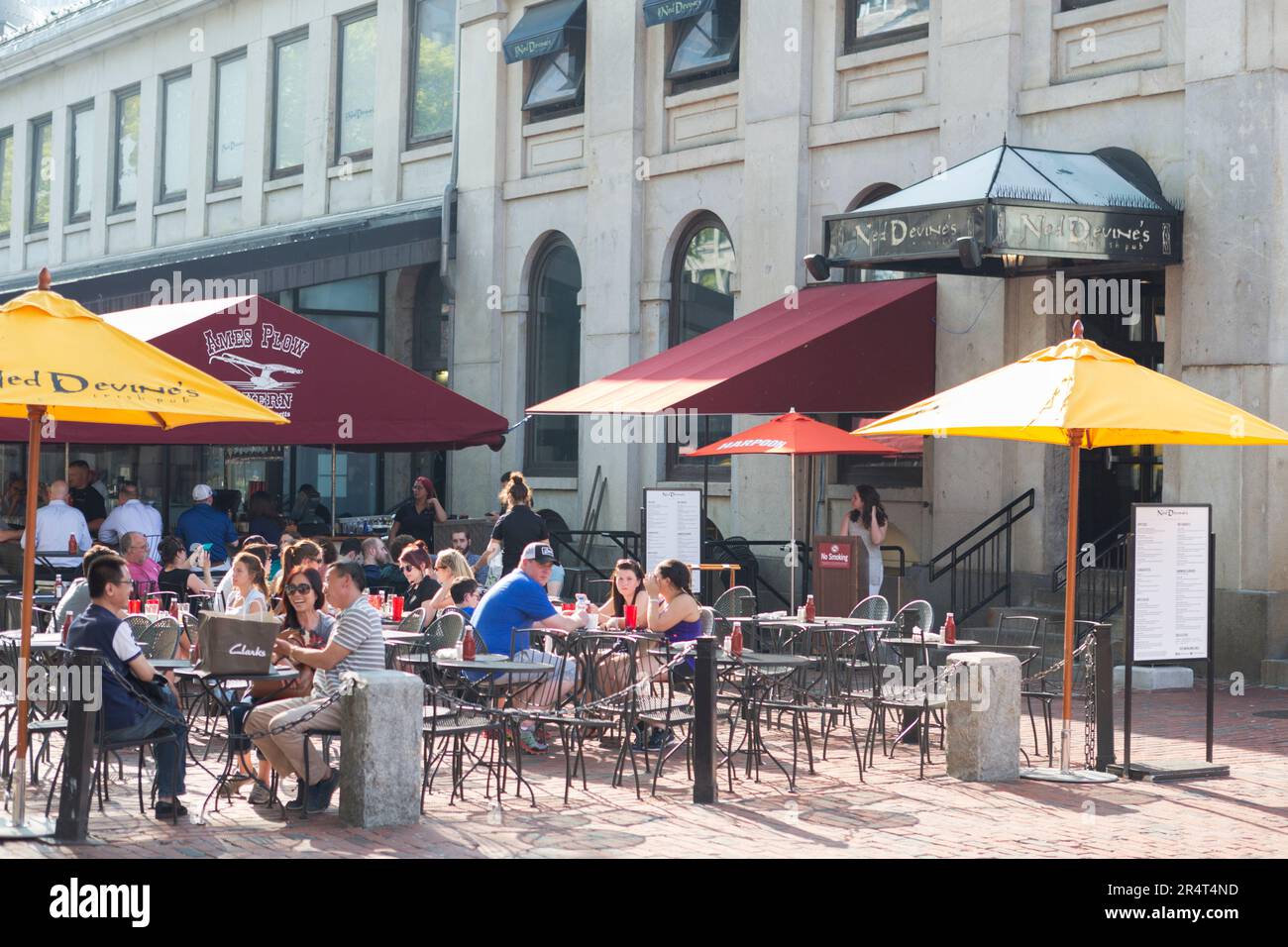USA, Massachusetts, Boston, Locals eating at food stalls outside Quincy Market Hall. Stock Photo