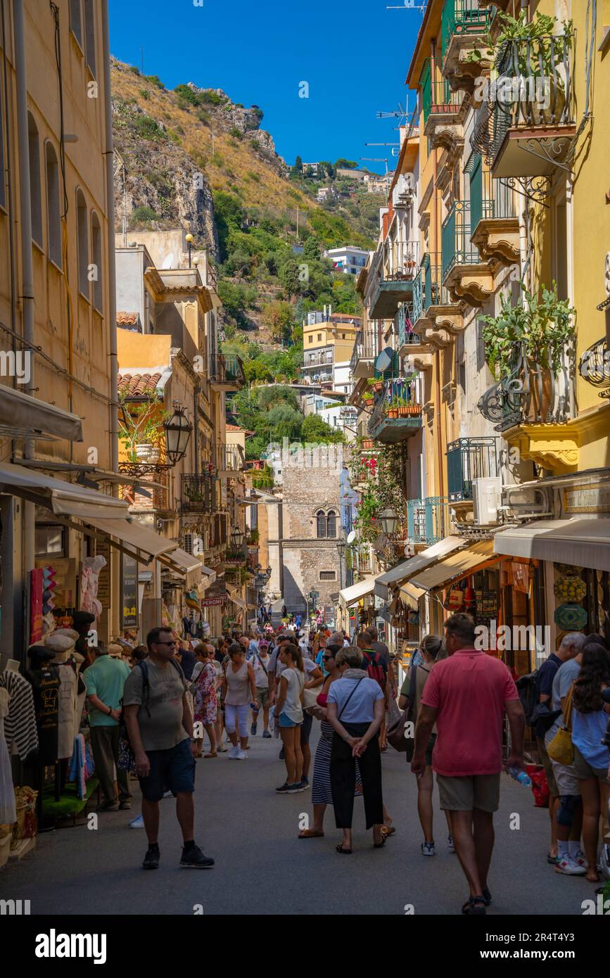 View of busy street and escalating hillside in background in Taormina, Taormina, Sicily, Italy, Europe Stock Photo