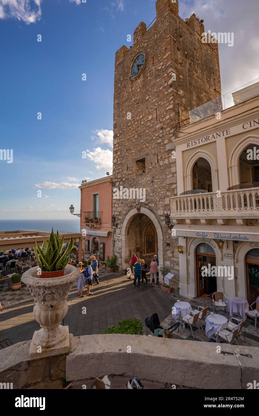 View of Torre dell'orologio e Porta di mezzo and busy street in Taormina, Taormina, Sicily, Italy, Europe Stock Photo