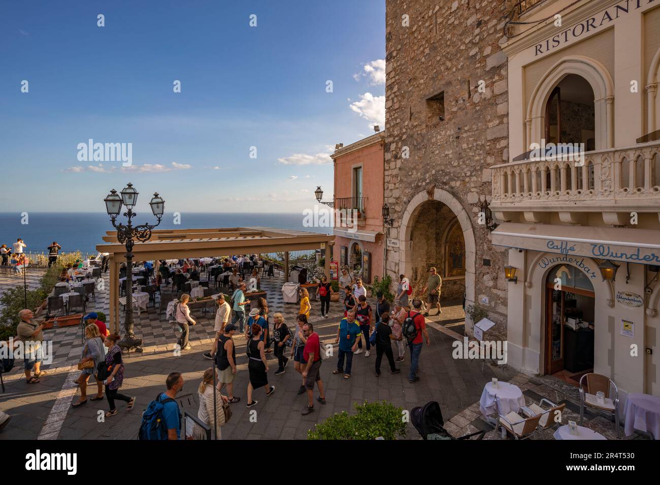 View of Torre dell'orologio e Porta di mezzo and busy street in Taormina, Taormina, Sicily, Italy, Europe Stock Photo