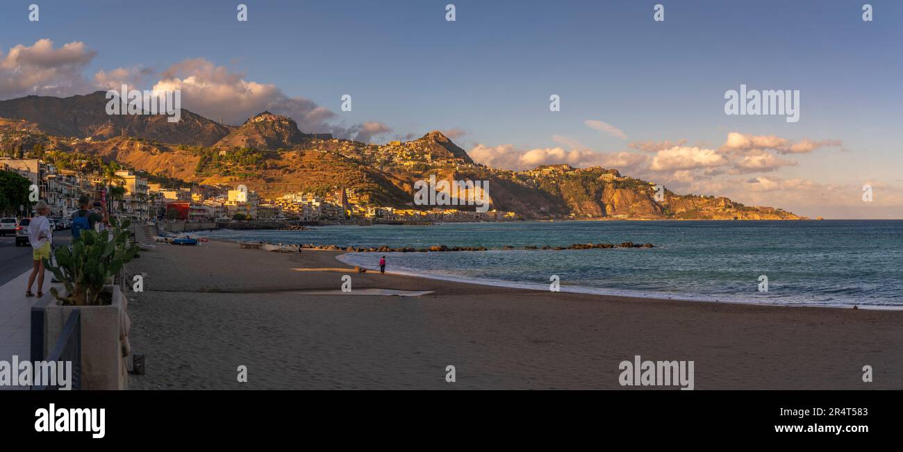 View of Castelmola, Taormina and Giardini Naxos viewed from Giardini Naxos beach, Sicily, Mediterranean, Italy, Europe Stock Photo