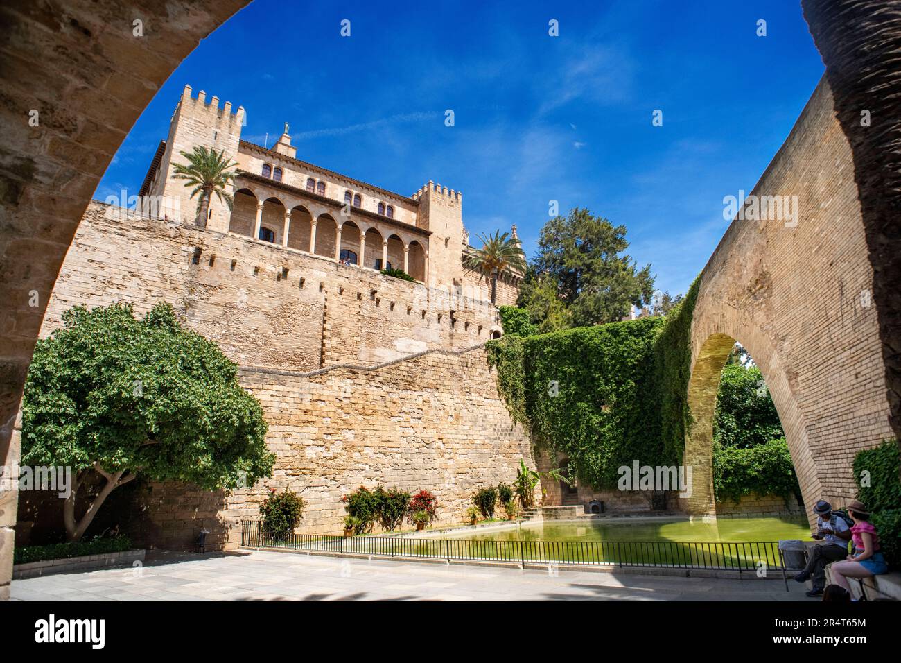 Swan lake and the Historic hallway with bows in the basement of the walls named Passeig Dalt Murada next to the Royal Palace of la Almudaina.  The Roy Stock Photo