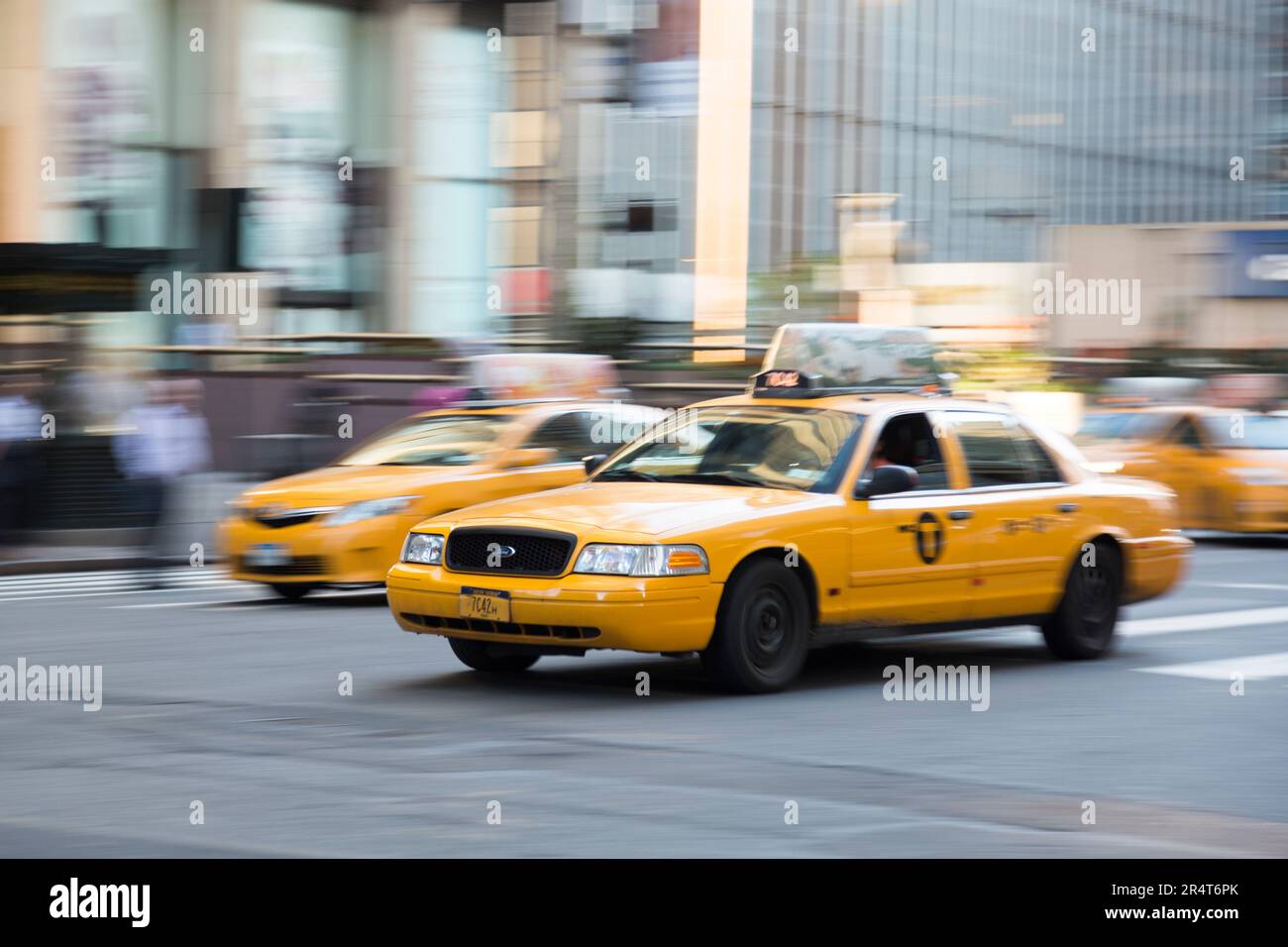 US, New York, Yellow taxi cabs along 7th avenue. Stock Photo