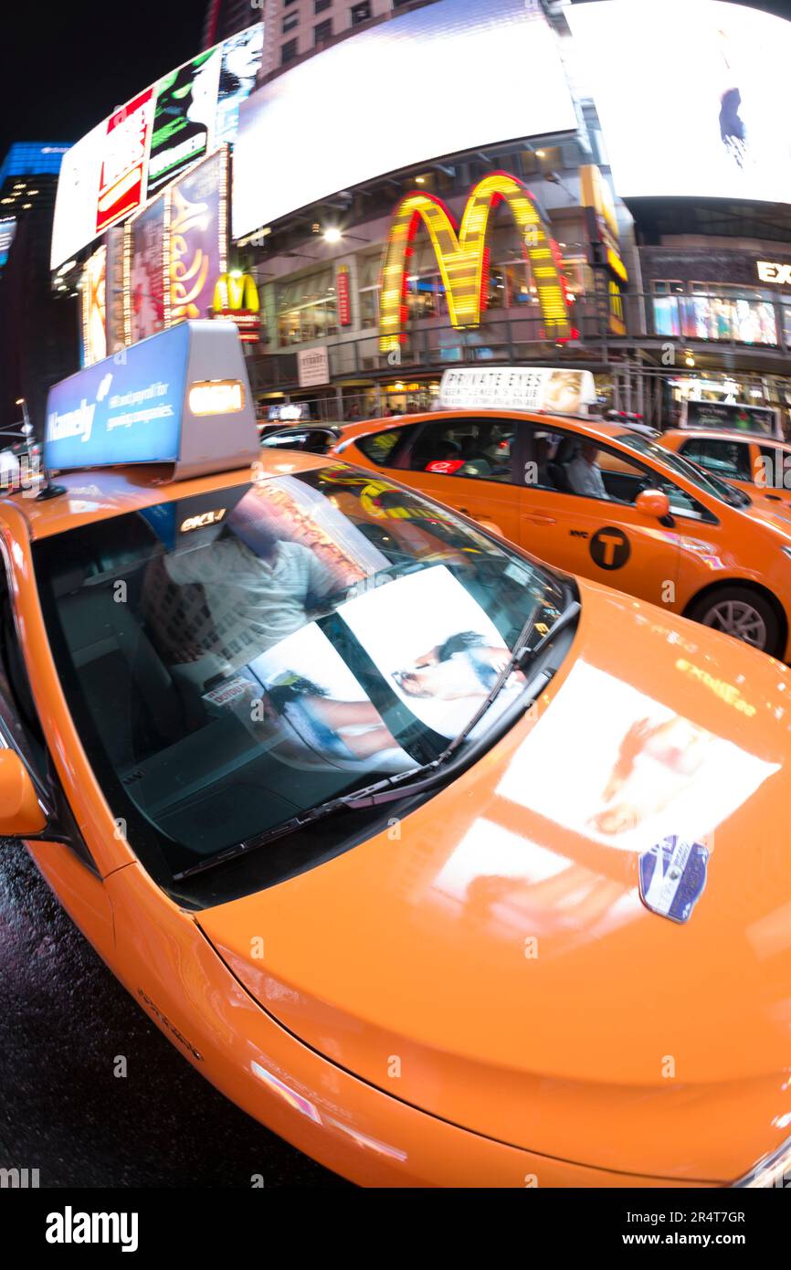 US, New York, Yellow cabs and neon billboards in times square Stock