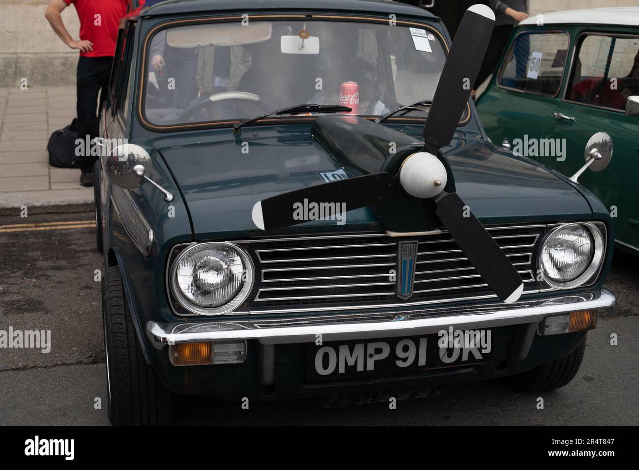 Brighton, UK - May 19 2019:  A black Mini car with a propeller over the engine is on show as part of the London Brighton Mini Run 2019 on the seafront Stock Photo
