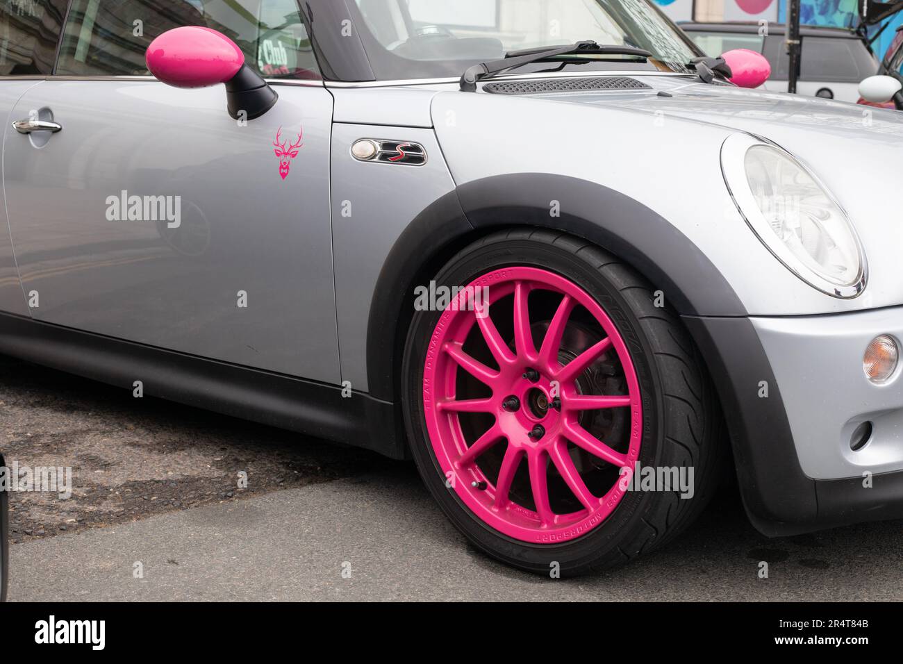 Brighton, UK - May 19 2019:  A detail view of a silver and bright pink Mini car taking part in the London Brighton Mini Run 2019. Stock Photo