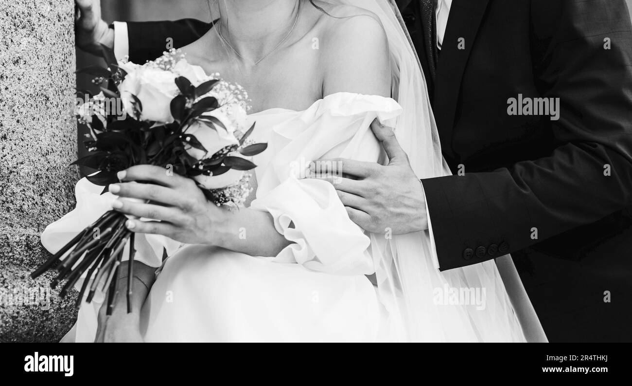 wedding couple embracing after wedding ceremony in city. Elegant bride