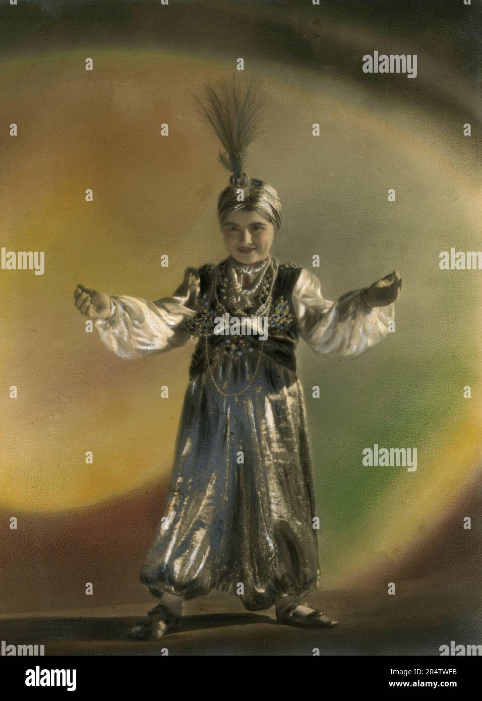 Hand-coloured portrait of a child dressed with a Carnival mask, Italy 1930s Stock Photo