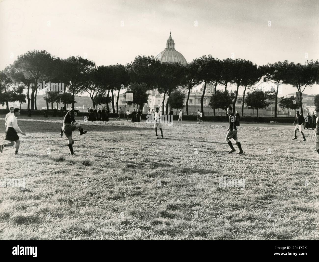 Children playing football in Villa Pamphili, Rome, Italy 1960s Stock Photo