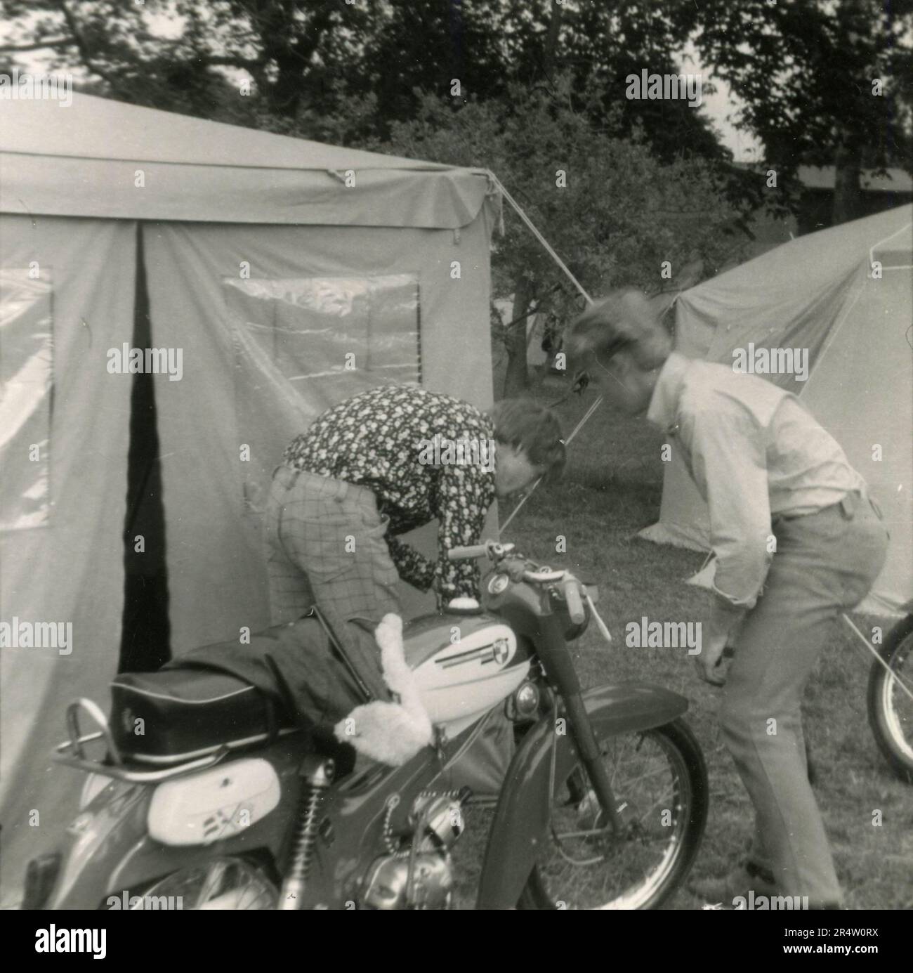 Camping in the 1960s: The tent and the motorbikes parked outside, Denmark 1966 Stock Photo