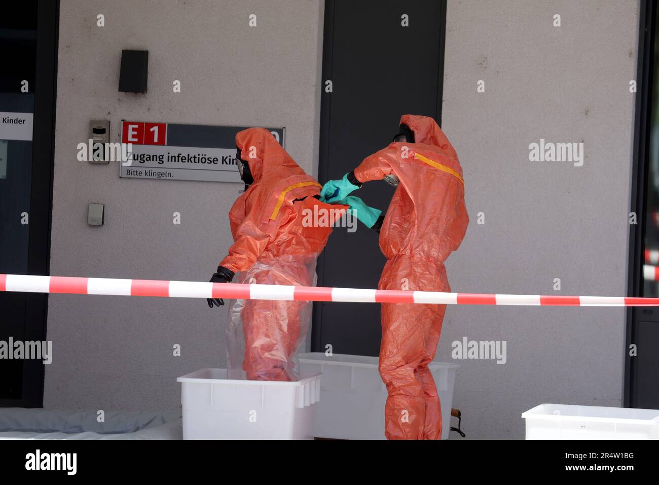 Jena, Germany. 30th May, 2023. Firefighters in protective suits stand