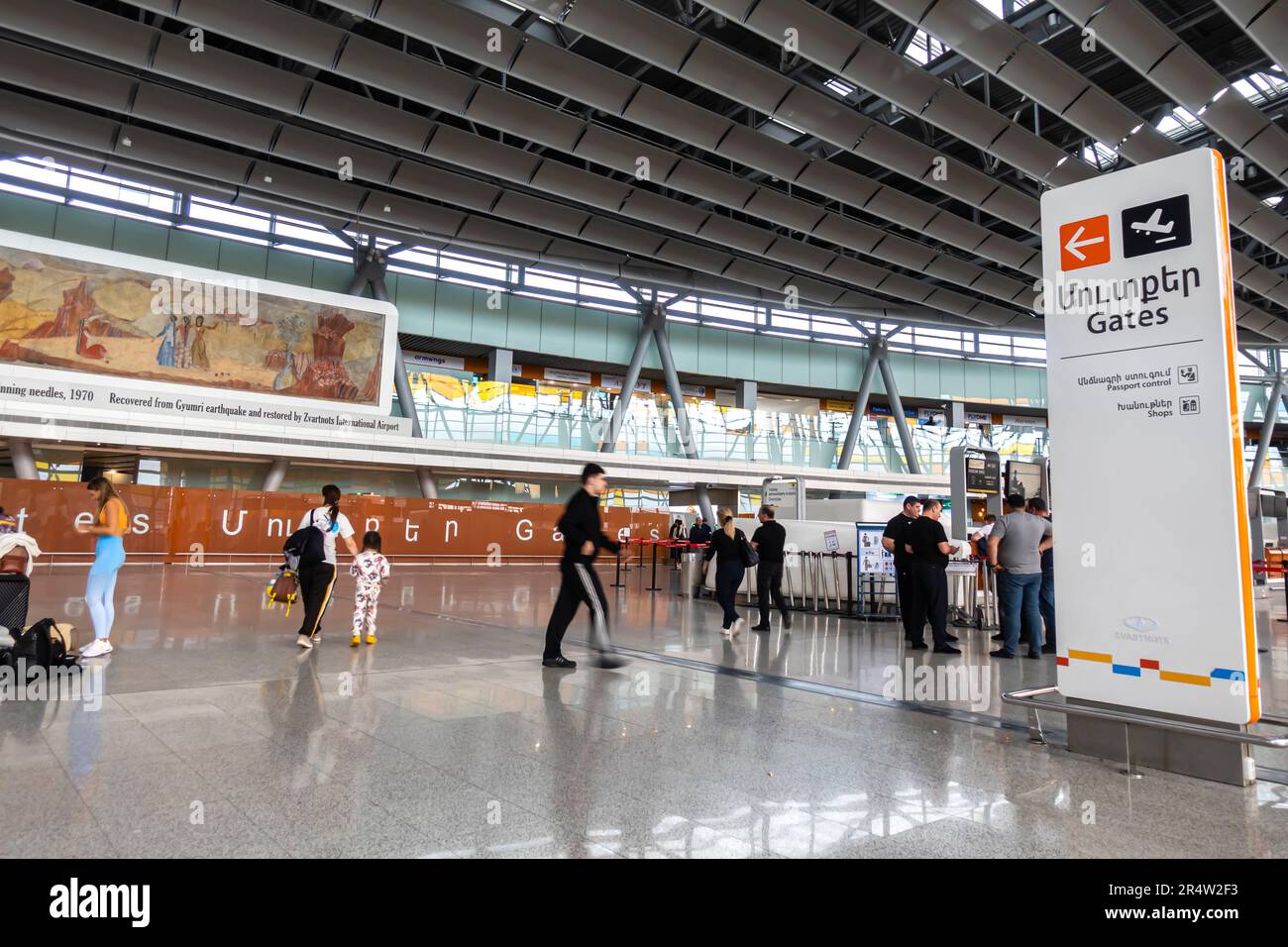 Gates direction sign, passport control, security check-in area at departures terminal in Zvartnots International Airport in Yerevan, Armenia. Stock Photo