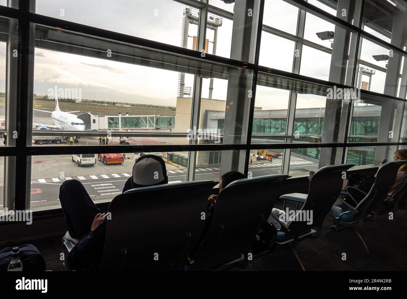 Looking out the window of the airport terminal to the airfield Zvartnots International Airport in Yerevan, Armenia. Stock Photo