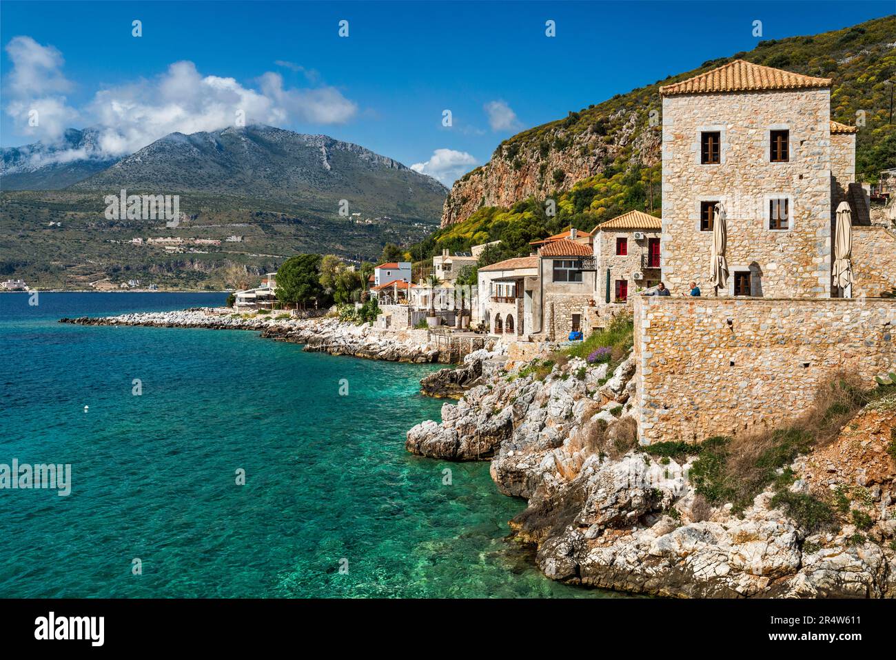 Mavromichalai Historic Hotel in tower house at village of Limeni, over Limeni Bay, Taygetos Mtns, Mesa Mani, Mani Peninsula, Peloponnese region Greece Stock Photo