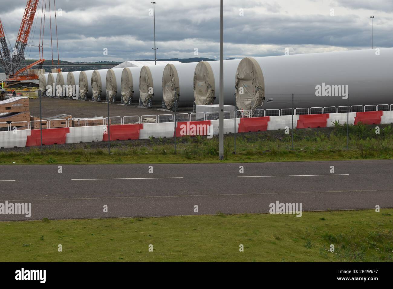 May 2023: Sections of Siemens wind turbine towers await pre-assembly at Port of Dundee before deployment to Neart na Gaoithe (NnG) offshore wind farm. Stock Photo