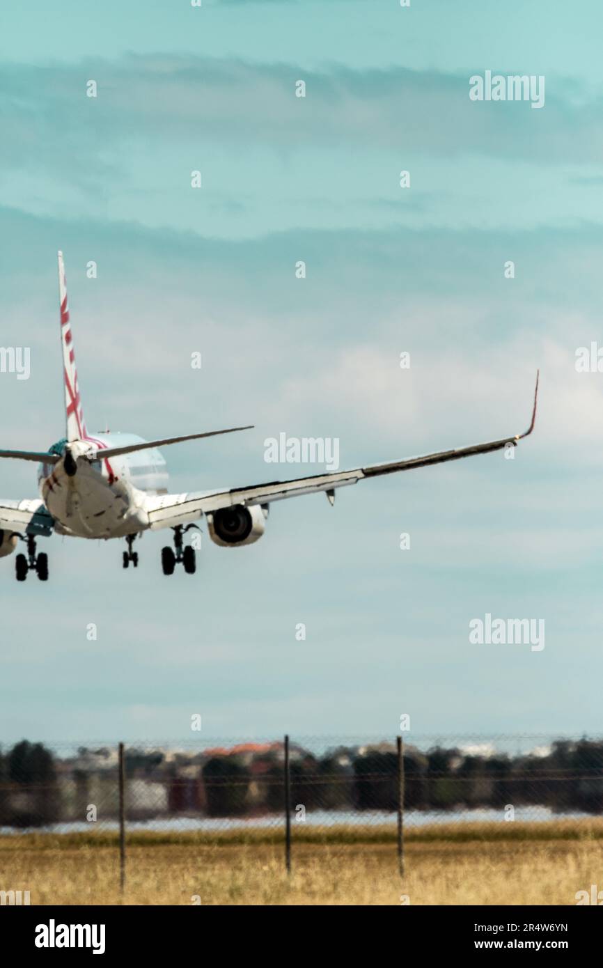 commercial planes flying near airport Stock Photo Alamy