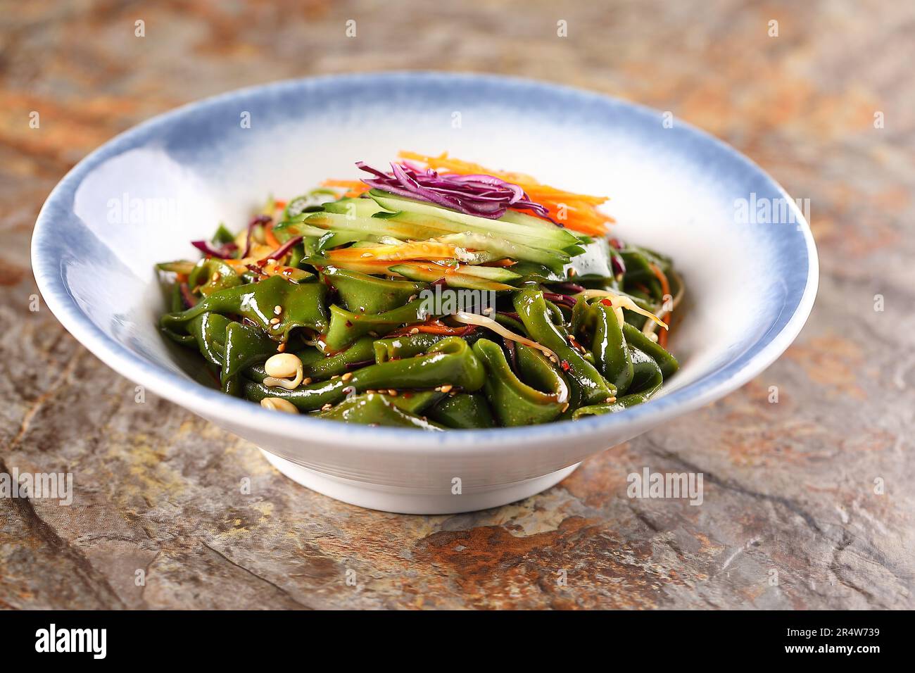 Tossed Mung Clear Noodles in Sauce，Liangpi，Chinese dish composed of cold skin noodles made from