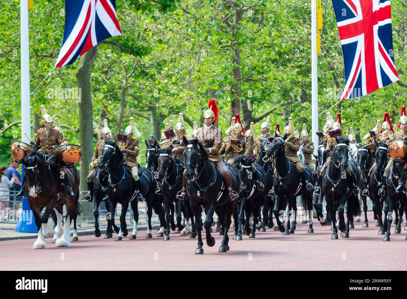 London, UK.  30 May 2023.  Members of the Household Division, out of ceremonial uniform, pass down The Mall towards Horse Guards Parade during a rehearsal for Trooping the Colour.  The Sovereign's birthday is officially celebrated by the ceremony of Trooping the Colour (King's Birthday Parade) and will be the first for King Charles.  A display of military pageantry will take place on 17 June with regiments of the Household Division marching down The Mall to Horse Guards Parade, where the King will attend and take the salute.  Credit: Stephen Chung / Alamy Live News Stock Photo