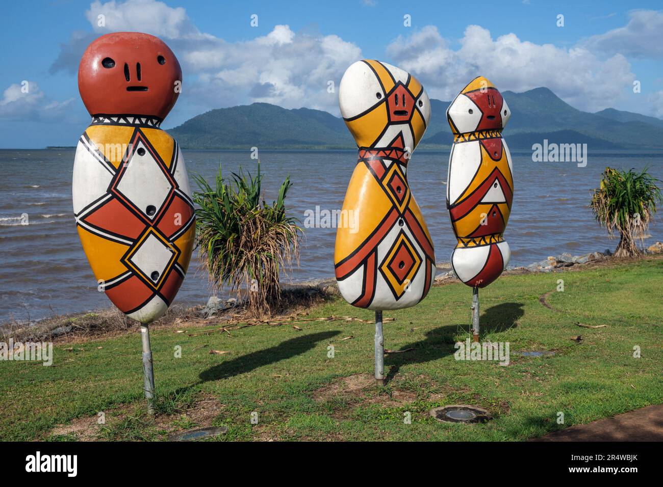 'Bagu on the Foreshore' art installation on the seafront at Cardwell with Hinchinbrook Island behind, Queensland, Australia Stock Photo