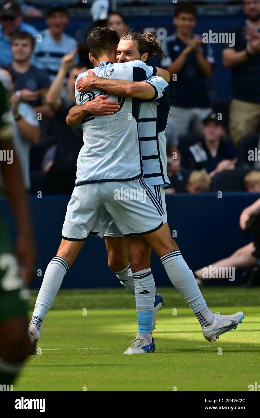 Kansas City, USA. 28th May, 2023. Sporting Kansas City midfielder Graham Zusi (8, right) hugs Sporting Kansas City forward Alán Pulido (9) after Pulido scored in the second half. Sporting KC defeated the Portland Timbers in a Major League Soccer game on May 28, 2023 at Children's Mercy Park Stadium in Kansas City, KS, USA. Photo by Tim Vizer/Sipa USA Credit: Sipa USA/Alamy Live News Stock Photo