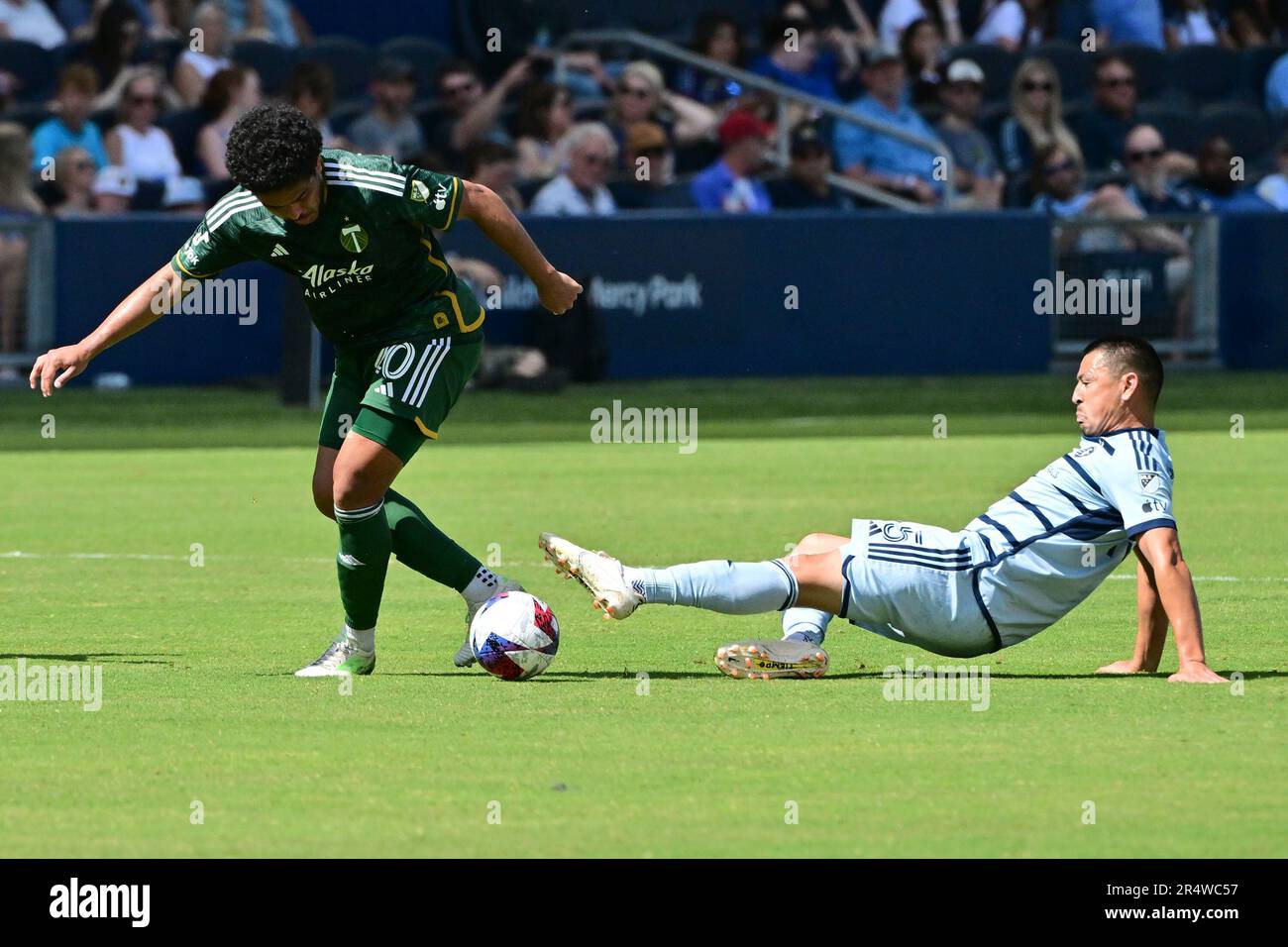 Kansas City, USA. 28th May, 2023. Portland Timbers midfielder Evander (20, left) moves the ball as Sporting Kansas City midfielder Roger Espinoza (15) tries to reach it with his foot. Sporting KC defeated the Portland Timbers in a Major League Soccer game on May 28, 2023 at Children's Mercy Park Stadium in Kansas City, KS, USA. Photo by Tim Vizer/Sipa USA Credit: Sipa USA/Alamy Live News Stock Photo