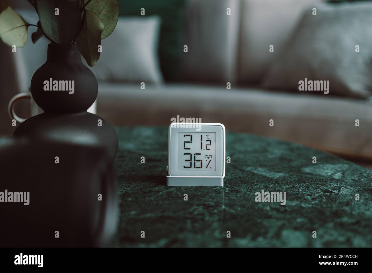 OLED display showing the central heating temperature setting on a