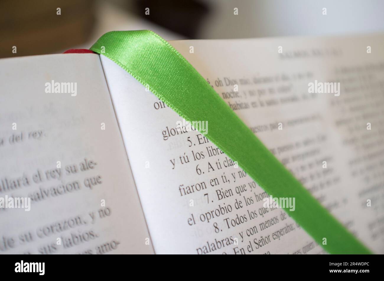 Open Bible at The Book of Psalms. Green bound bookmark over the page Stock Photo
