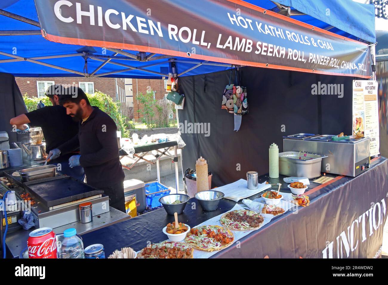 Indian street food stall selling hot Kathi rolls in Greenwich, London, with fresh chicken, lamb seekh, paneer, and chana rolls cooked to order Stock Photo