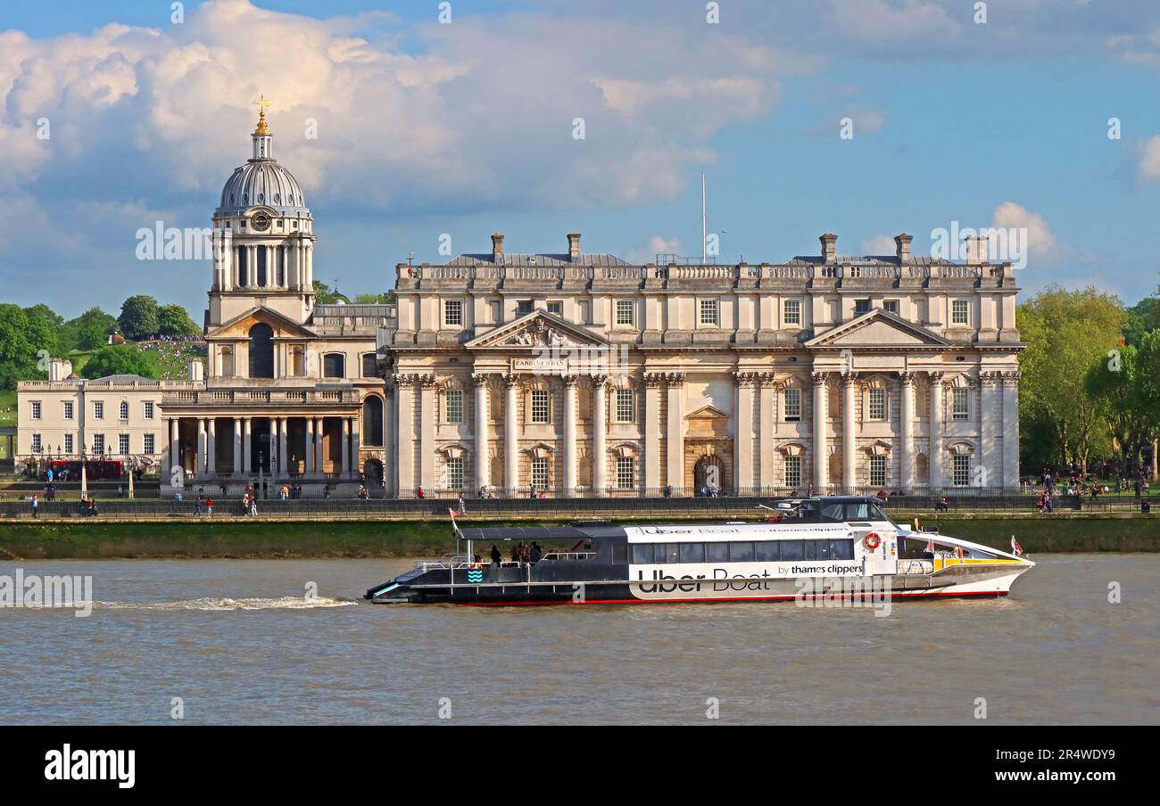 Uber Thames Clipper boat, passes Greenwich National Maritime Museum,  going west towards Canary Wharf and central London Stock Photo