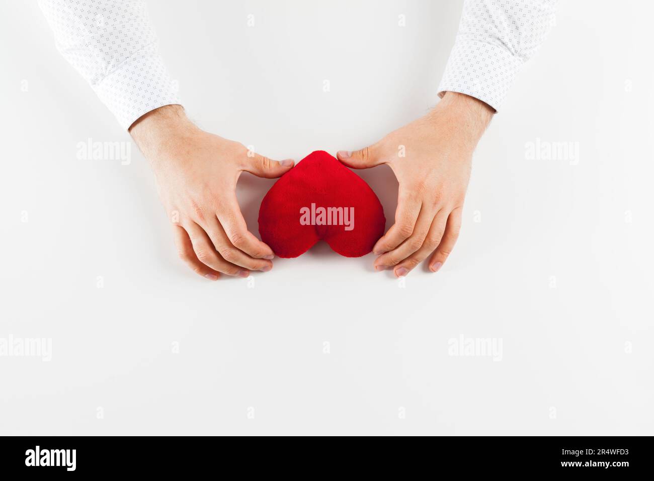 Red heart in girl hand isolate on white background Stock Photo - Alamy