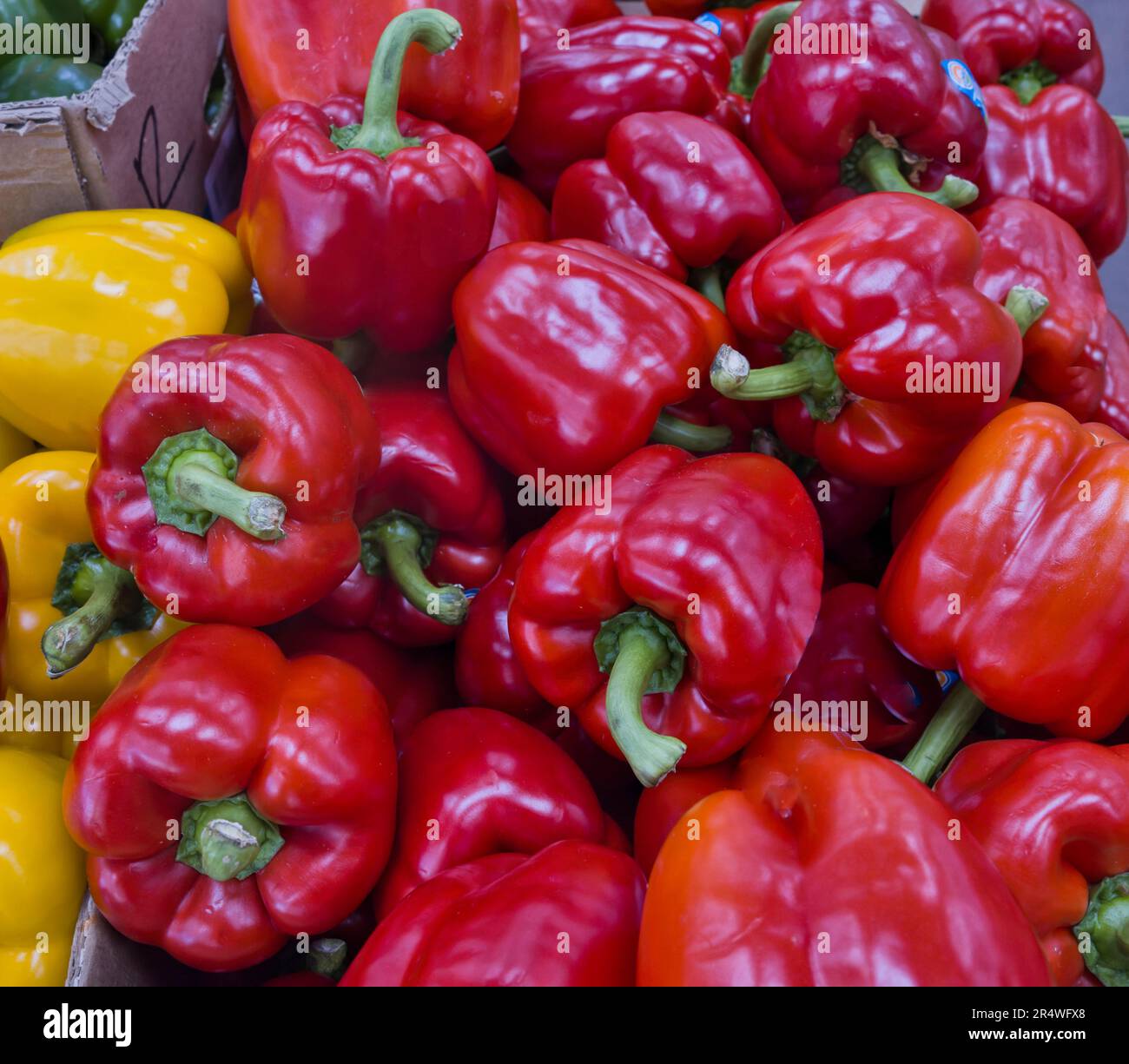 Organic red bell peppers in market Stock Photo - Alamy