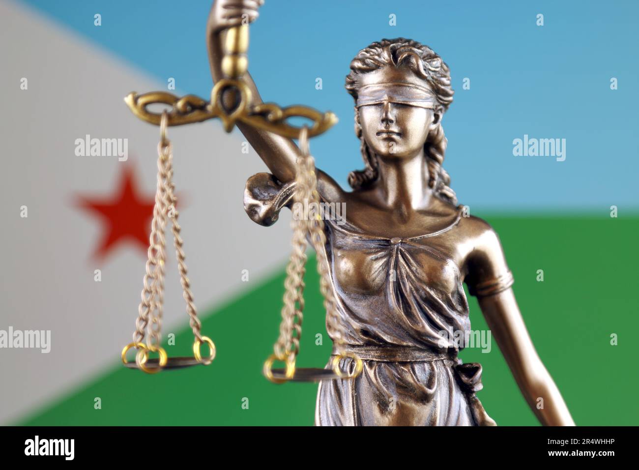 Symbol of law and justice with Djibouti Flag. Close up. Stock Photo