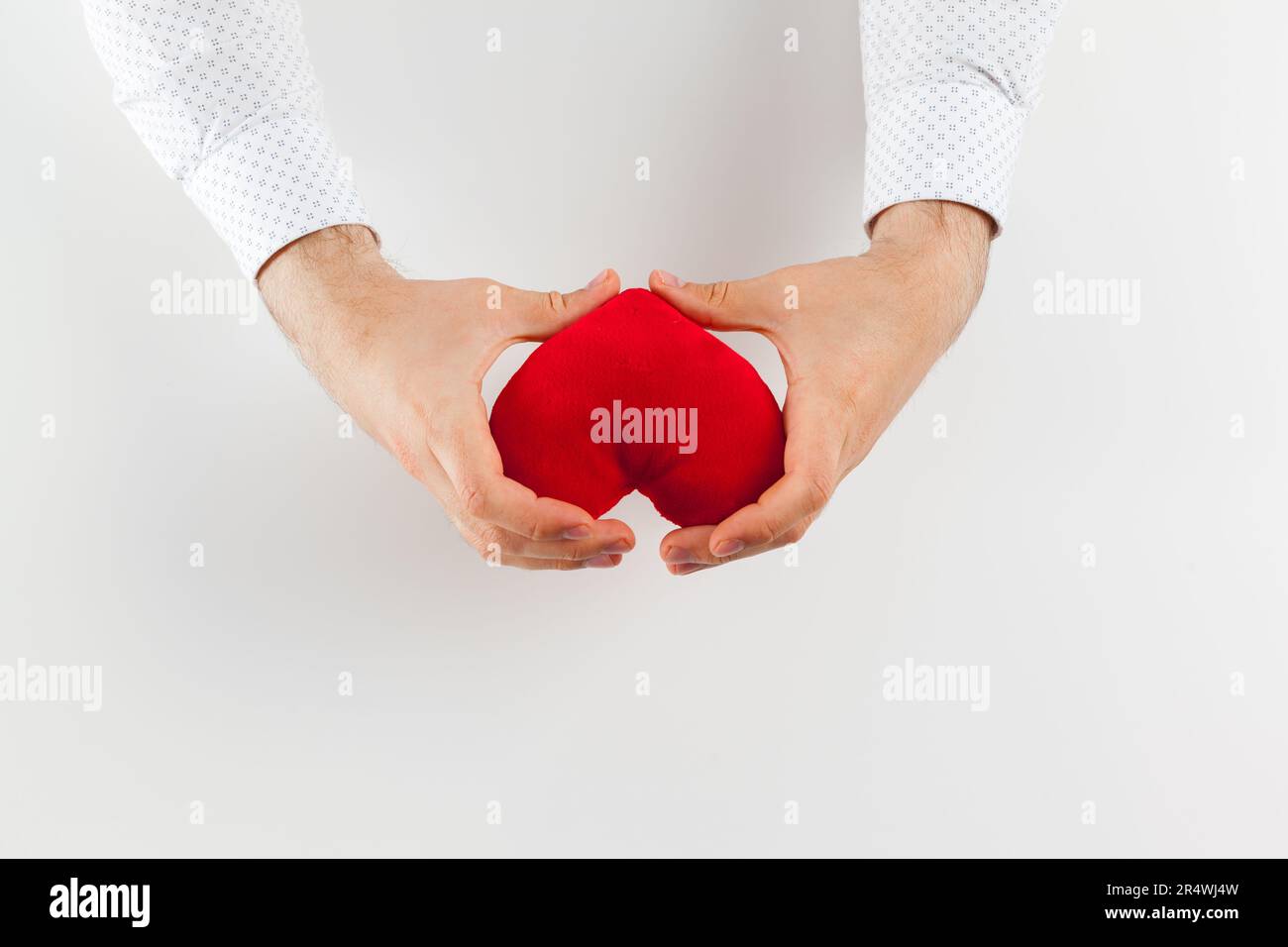 Red heart in girl hand isolate on white background Stock Photo - Alamy