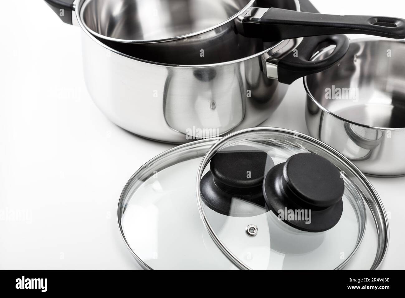 Stainless steel pots and pans isolated on white Stock Photo Alamy