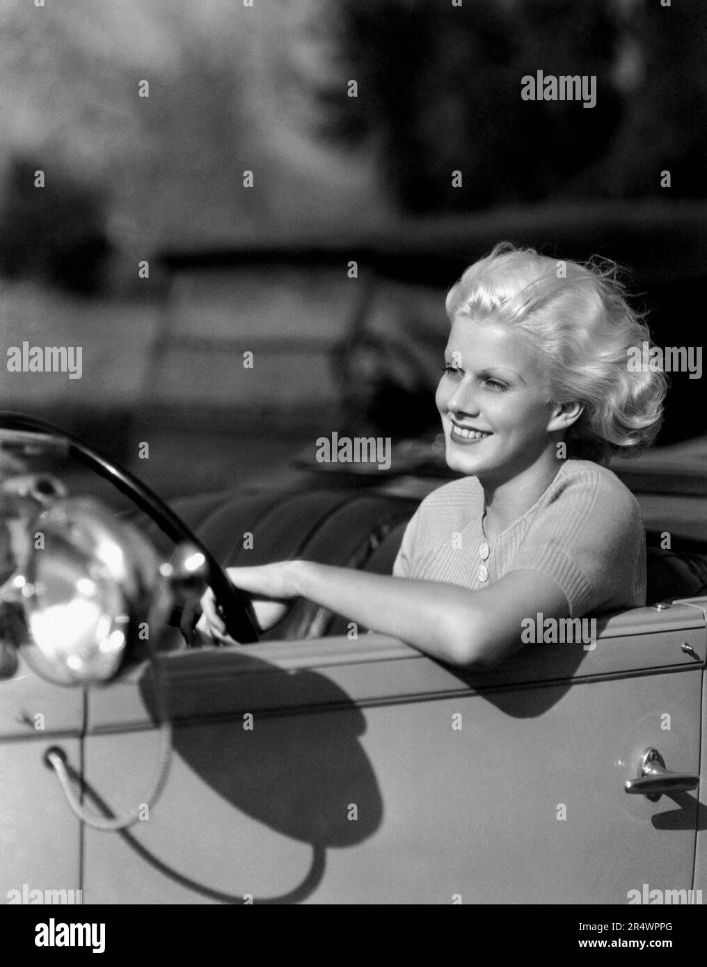 Jean Harlow driving her Eight 903 Deluxe Sport Packard Phaeton. Stock Photo