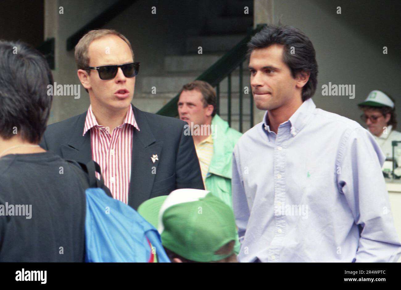 Prince Albert of Monaco and Jean-Yves Le Fur arriving in the stands of the French Open in June 1990. Stock Photo